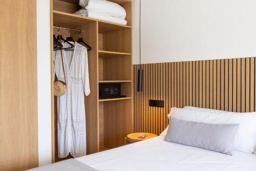 a bedroom with a bed and a closet at Hotel Bahia Pollensa in Port de Pollensa