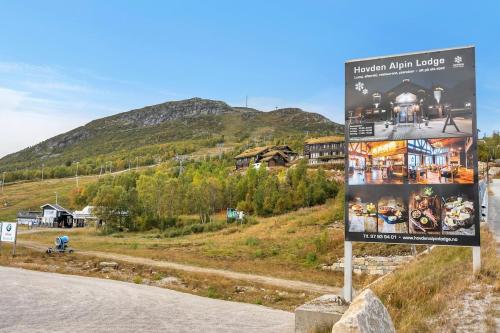 a sign on the side of a road at Hovden Alpin Lodge Appartement in Bykle