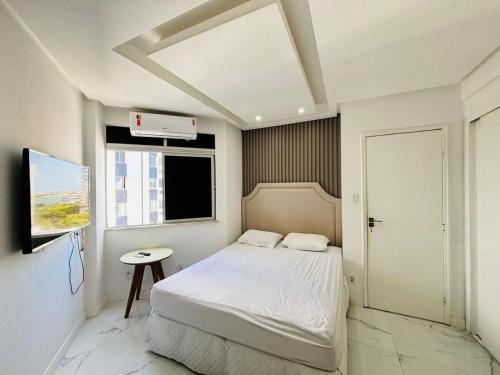 Giường trong phòng chung tại Apartamento alto padrão com área gourmet