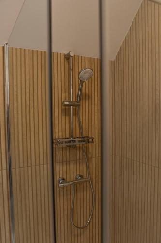 a shower in a shower stall with a shower head at Motel DB2000 in Biłgoraj