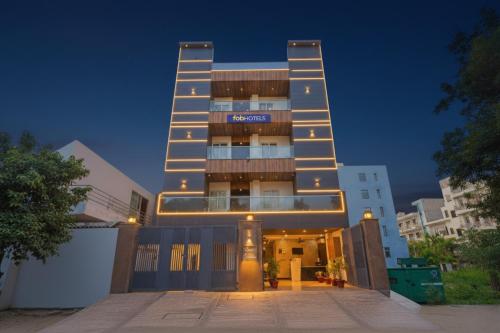 a building with a sign on the front of it at FabHotel Grand Olive I in Noida