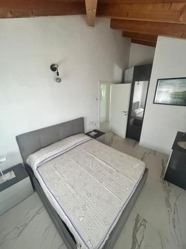 En eller flere senge i et værelse på Ca' Caola Relax