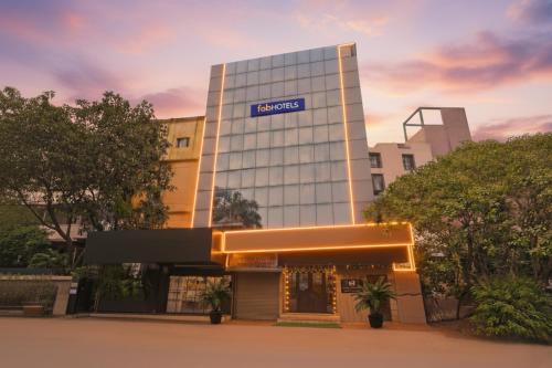 a building with a sign on the side of it at FabHotel Gulshan International - Nr Peter Cat Park Street in Kolkata