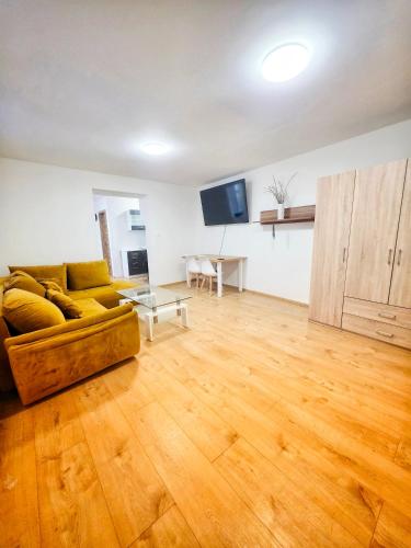 a living room with a couch and a table at Apartmán Gabriel in Kežmarok