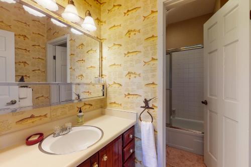 a bathroom with a sink and a mirror at Sun Vail 24B in Vail