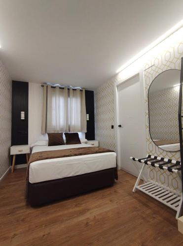 Ένα ή περισσότερα κρεβάτια σε δωμάτιο στο JQ Madrid 2