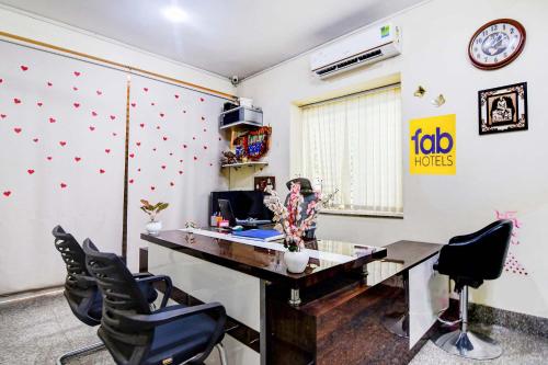 an office with a desk and chairs in a room at FabHotel Urban Classy in Bhubaneshwar