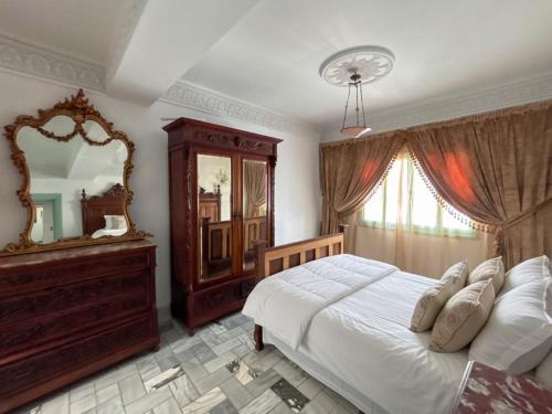 Cama o camas de una habitación en Dar El Nour Corniche Hammamet