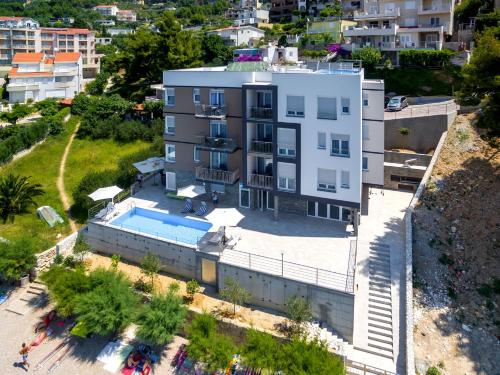 an aerial view of a building with a swimming pool at Villa Veronika in Omiš