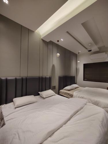 Ένα ή περισσότερα κρεβάτια σε δωμάτιο στο Exotica Stays