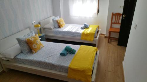 Ένα ή περισσότερα κρεβάτια σε δωμάτιο στο Casa Patines