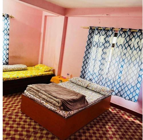 Katil atau katil-katil dalam bilik di Pur guest house