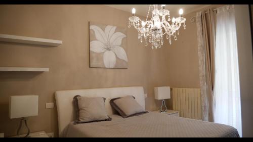Un pat sau paturi într-o cameră la Villa Alba