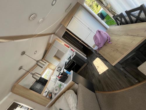 an overhead view of a living room and kitchen in a tiny house at Luxury 3 bed swift home in Hastings