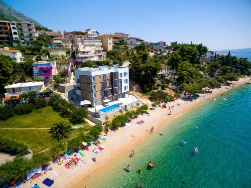 an aerial view of a beach with people in the water at Villa Veronika in Omiš