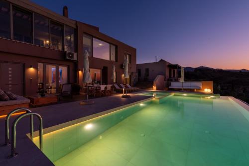 a swimming pool in the middle of a house at Mama Georgia's Villa in Heraklio Town