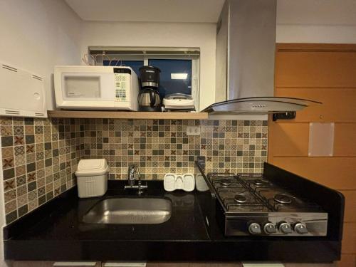 Kuchyň nebo kuchyňský kout v ubytování Apartamento à beira-mar