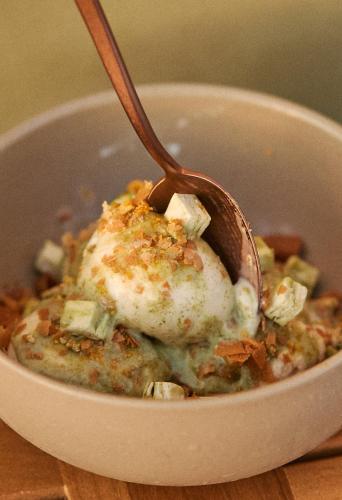 a bowl of food with a spoon in it at Hotel Erwin Venice Beach in Los Angeles