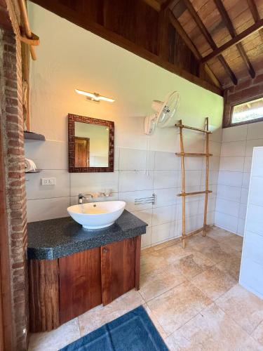 a bathroom with a sink and a mirror at Villa Helios in Pai