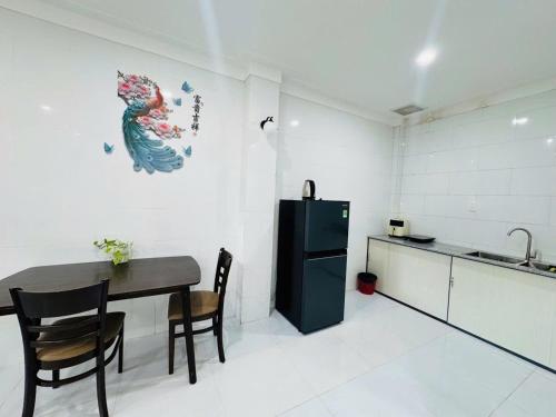 Kuchyň nebo kuchyňský kout v ubytování Căn Hộ Dương Đông town Hotel