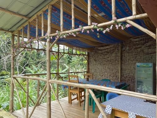 a patio with a table and chairs in a house at Casas Salomão in Santo António
