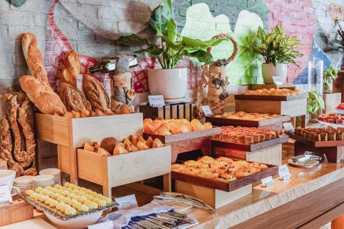 a bakery with various types of bread and pastries at VELA OCEAN LUXURY SUITES Nha Trang Centre in Nha Trang