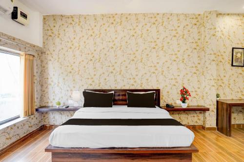 Ένα ή περισσότερα κρεβάτια σε δωμάτιο στο Hotel O Raj Ambessy