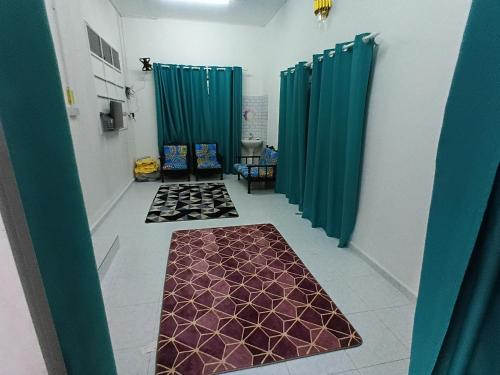 Ένα ή περισσότερα κρεβάτια σε δωμάτιο στο Homestay Puteri D'Durian Guling