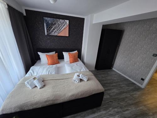 a bedroom with a bed with towels on it at Harmonie-Oase in Alsleben