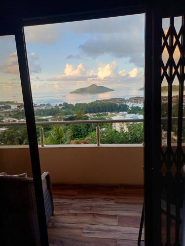 a view from a balcony with a view of the ocean at 180 Degrees Self-Catering in Victoria