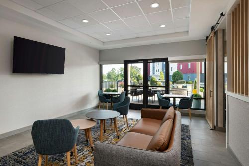 a lobby with a couch and chairs and a table at TownePlace Suites North Little Rock  in North Little Rock