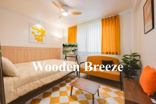 a bedroom with a bed and a couch and a table at Wooden Breeze - 1 min walk from the subway station in Seoul