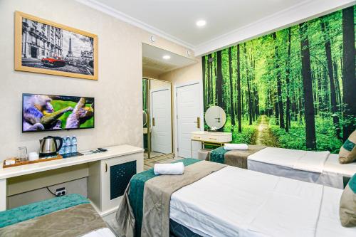 Ένα ή περισσότερα κρεβάτια σε δωμάτιο στο Essam Deluxe Hotel