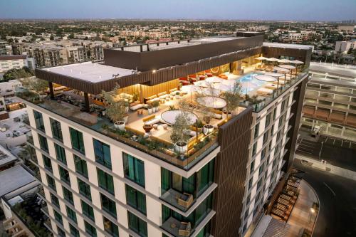 an overhead view of a building with a pool at The REMI Scottsdale, Autograph Collection in Scottsdale
