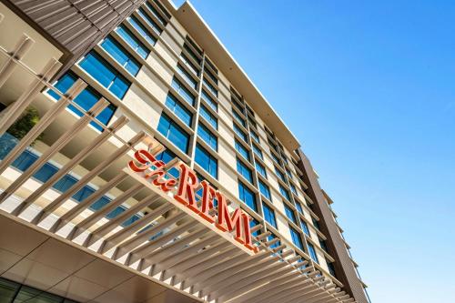 a hotel sign on the side of a building at The REMI Scottsdale, Autograph Collection in Scottsdale