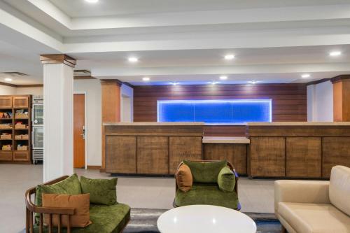 a lobby with a large screen in the background at Fairfield by Marriott Ruston in Ruston