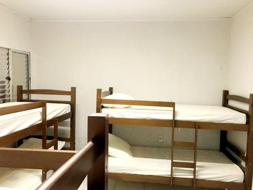 a group of bunk beds in a room at Hostel JK in Bom Jesus
