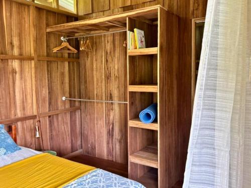 a bedroom with a bed and a book shelf at Avalon Initiative in Volio