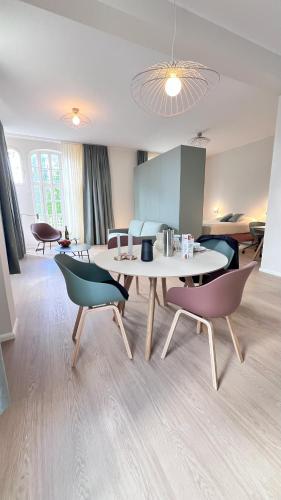 a dining room with a table and chairs at Key Inn Appart Hotel Belair in Luxembourg