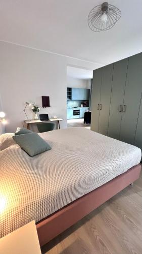 a bedroom with a large bed and a desk at Key Inn Appart Hotel Belair in Luxembourg
