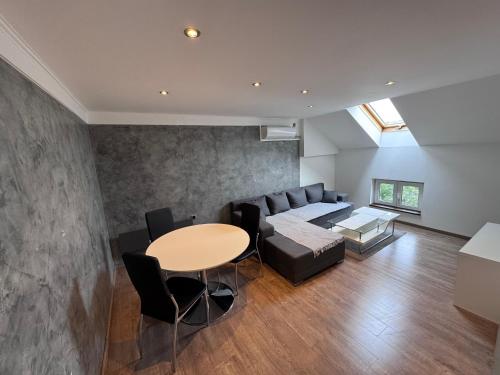 a living room with a couch and a table at Central Park Apartments in Belgrade