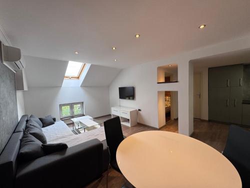 a living room with a couch and a table at Central Park Apartments in Belgrade