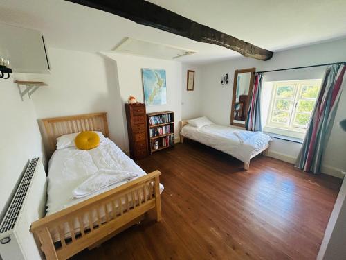 En eller flere senge i et værelse på Bailey Glace Farmhouse Monmouth