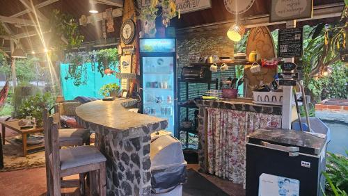 a room with a counter and a bar with plants at Sweet Dreams in San Carlos