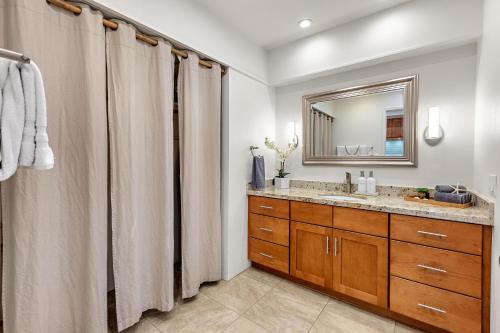 a bathroom with a sink and a mirror at Maui Eldorado Condo G203 in Kaanapali