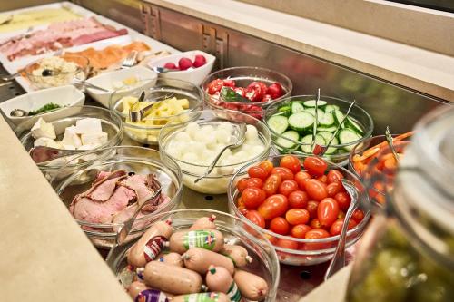 a bunch of different types of vegetables on a counter at Hotel Amberger Hof in Bad Koetzting