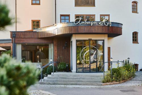 a store front of a building with a sign on it at Hotel Amberger Hof in Bad Koetzting
