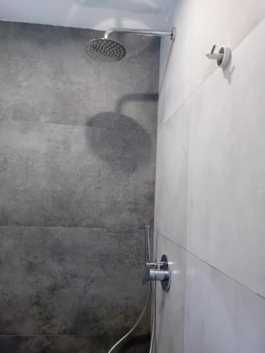 a shower in a bathroom with a glass door at Villa Krini in Skiathos Town