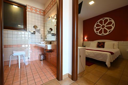 Кровать или кровати в номере Hotel Relais Antica Masseria