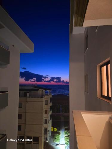 a view of the ocean at night from a building at Nova Apartaments Qerret in Golem